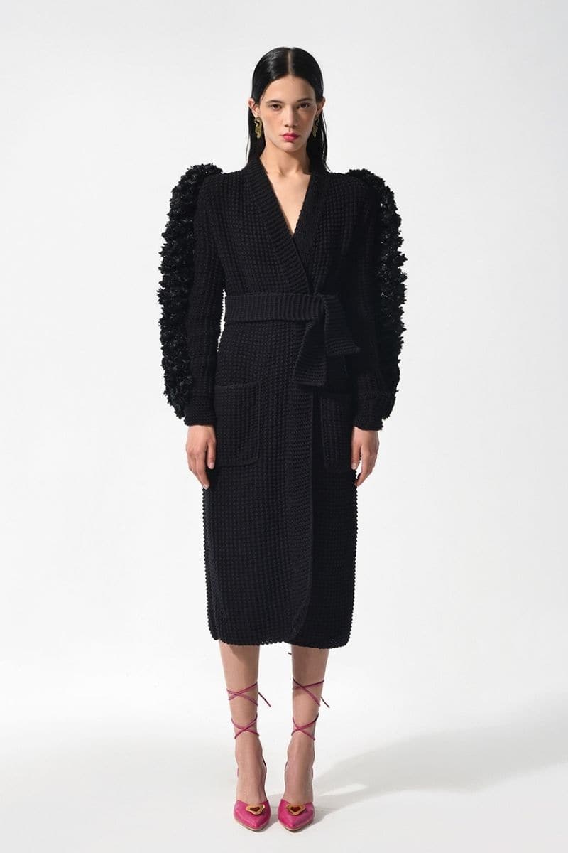 Black Liya statement sleeves cardigan, featuring bold, voluminous sleeves and a cozy knit design, ideal for stylish layering.