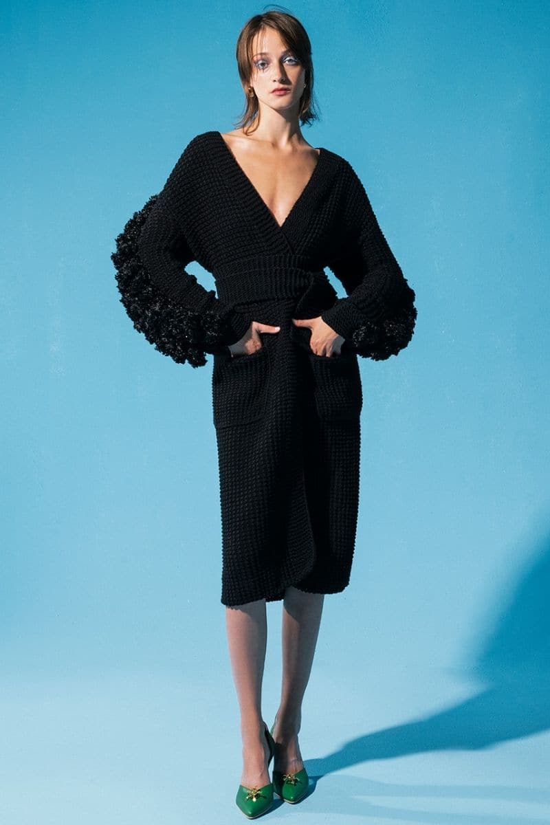 Black Liya statement sleeves cardigan featuring bold, stylish sleeves and a cozy knit design, ideal for modern fashion looks.