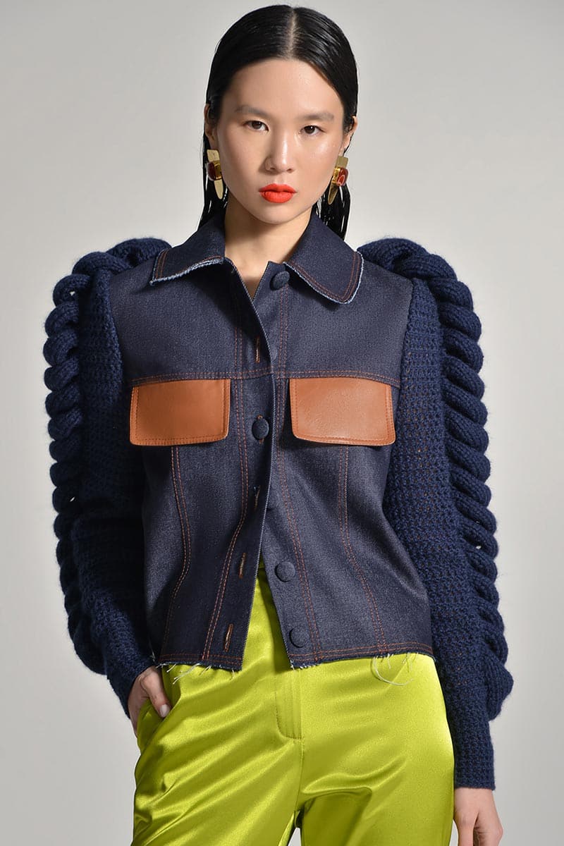 Navy blue denim blazer with contrasting knitted sleeves by Liya, featuring tailored fit and stylish design.