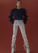 Liya hand-knitted wool-blend black sweater with navy accents, soft and cozy, featuring a classic knit pattern and long sleeves.