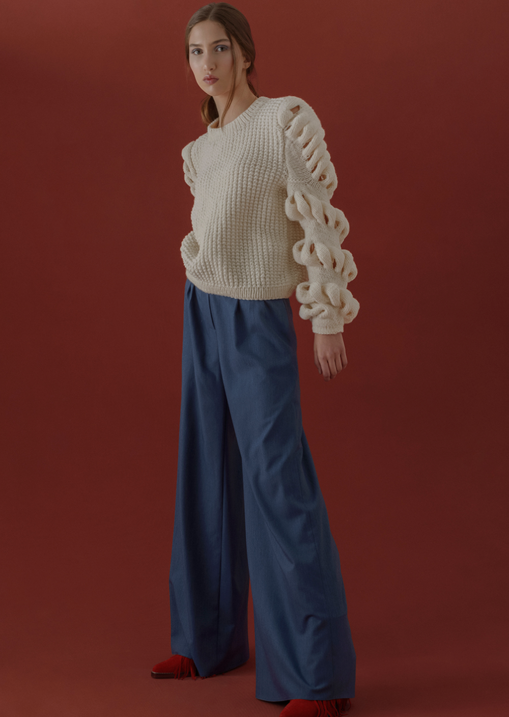 Liya cream hand-knitted wool-blend sweater with a cozy, textured design, featuring a relaxed fit and ribbed cuffs.