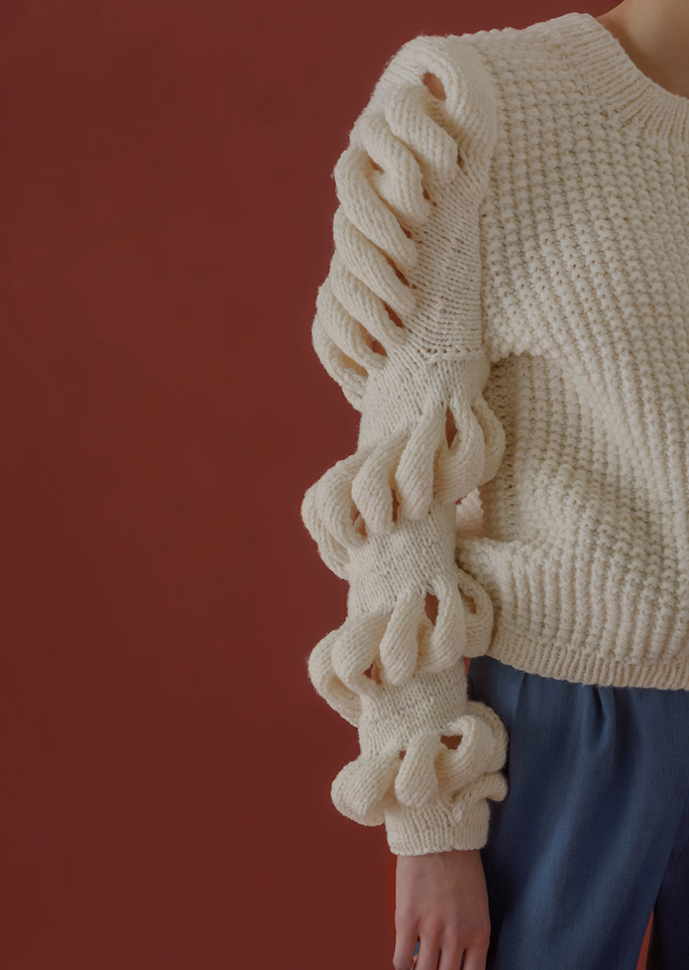 Liya hand-knitted wool-blend sweater in cream with a cozy, textured knit pattern, long sleeves, and a relaxed fit.