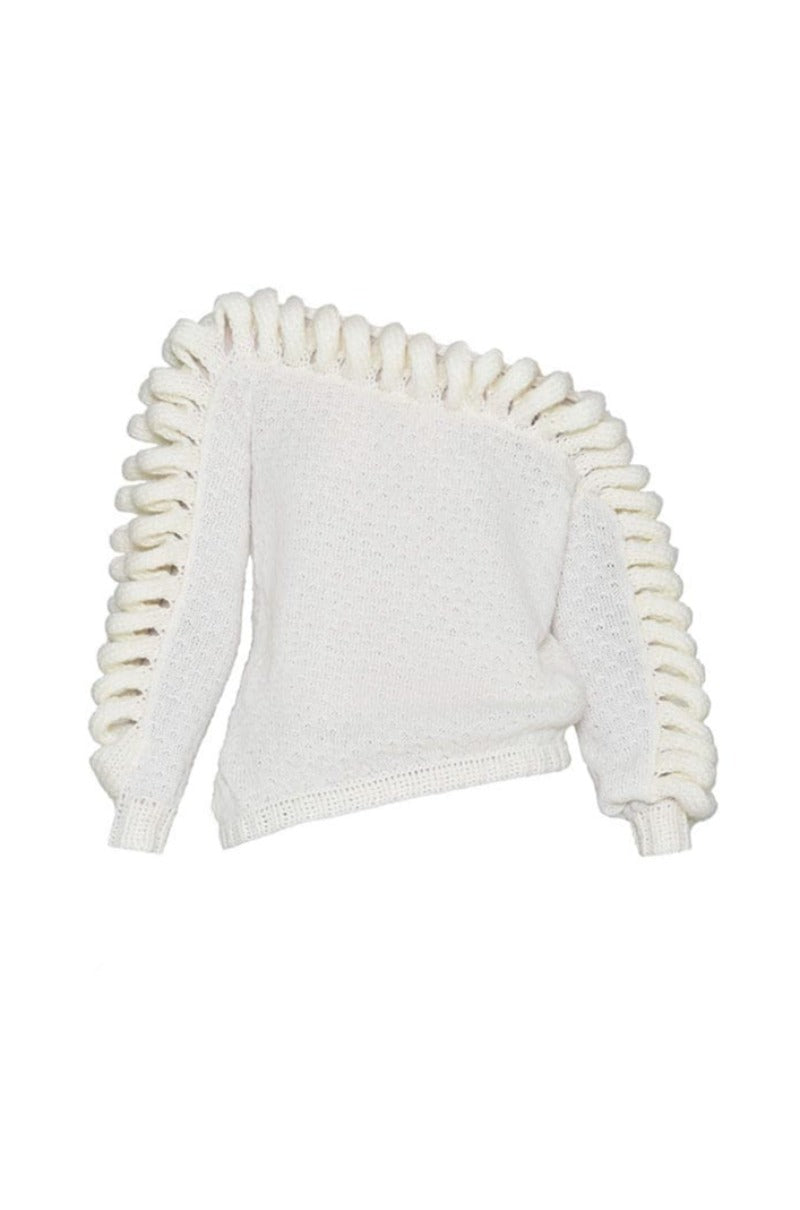 White Liya off-shoulder knit sweater displayed on a model, showcasing its relaxed fit and stylish neckline.