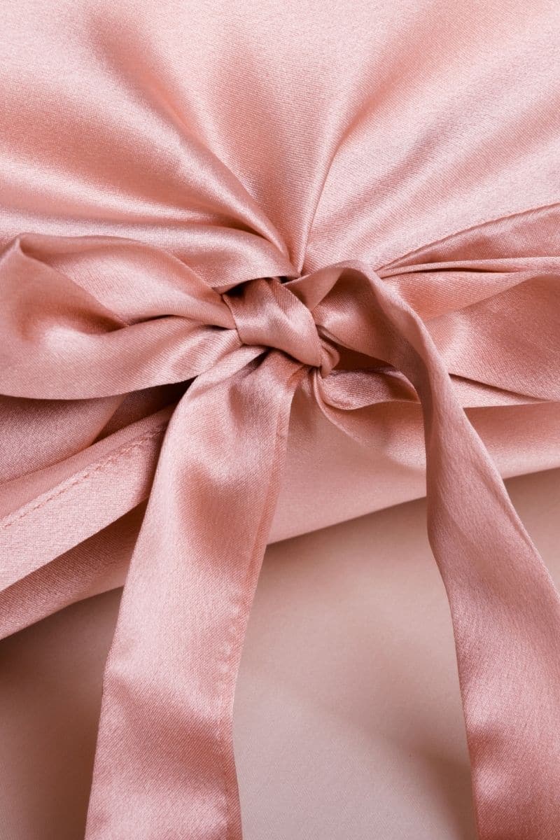Queen-size silk pillowcase in rose pink by Not Just Pajama, soft and smooth fabric with elegant color and plush texture.