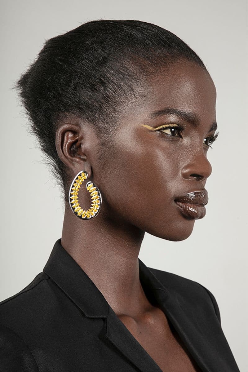 Yellow Santa Fe earrings by Sara Shala featuring vibrant yellow design with intricate details and dangle style.