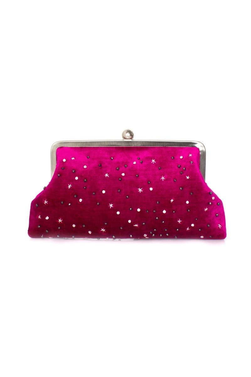 Customized fuchsia velvet clutch by Sarah's Bag with elegant design and soft textured fabric for stylish evening wear.