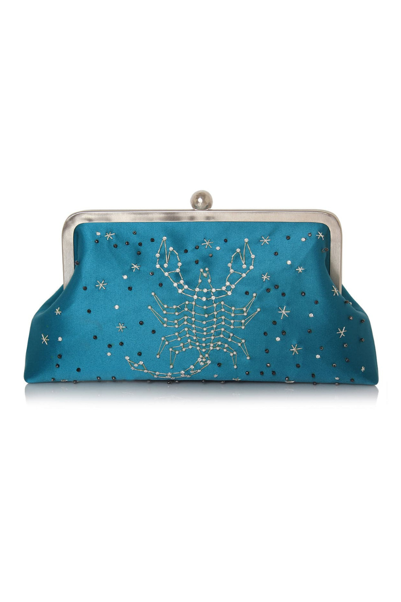 Personalized Astro Clutch by Sarah's Bag in black with Aries zodiac sign and constellation design.