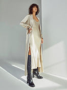 Oyster silk midi slip dress by Silked, featuring a sleek, elegant design with thin straps and a smooth, flowing fabric.