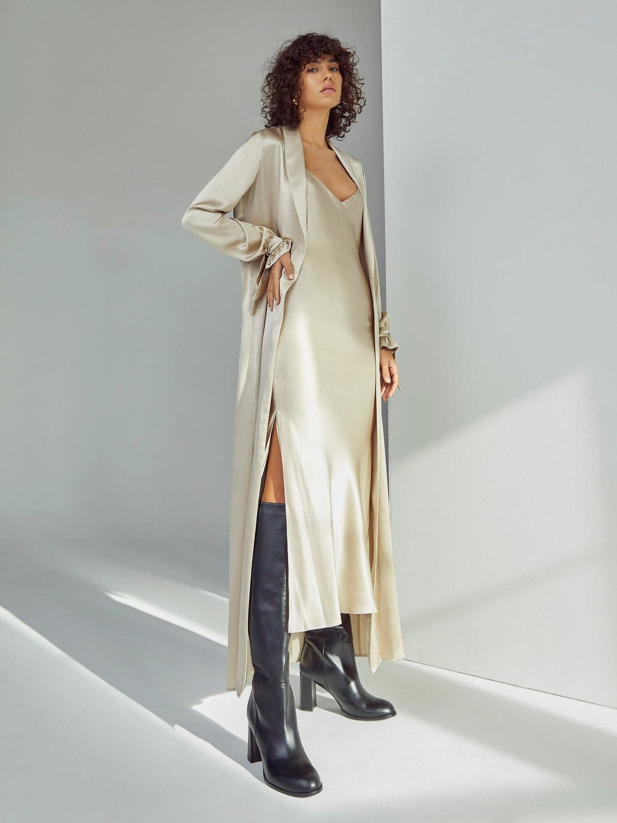 Oyster silk midi slip dress by Silked, featuring a sleek, elegant design with thin straps and a smooth, flowing fabric.