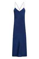 Silked sapphire silk midi slip dress displayed on a model, featuring a sleek, elegant design and smooth silk fabric.