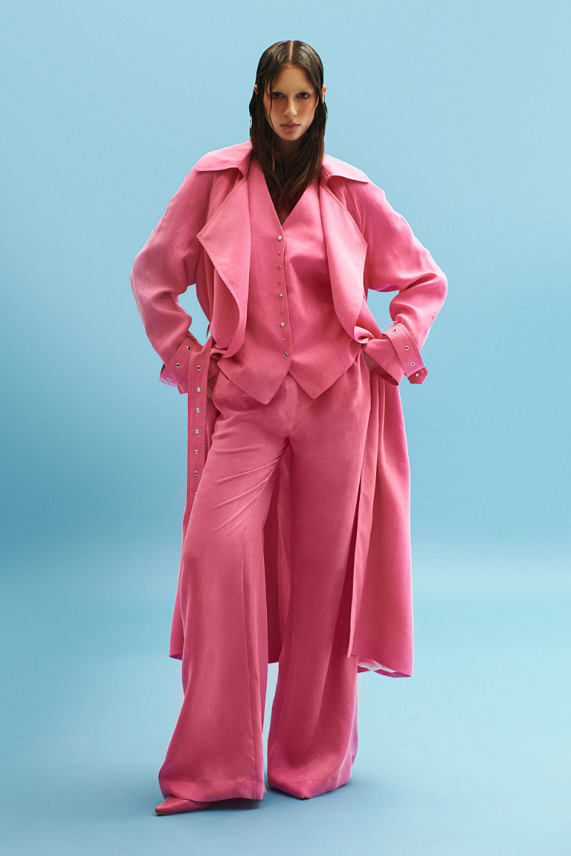 Vaska belted hot pink trench coat with a waist belt, long sleeves, and classic collar, stylish outerwear in vibrant pink.