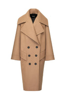 Vaska double-breasted relaxed coat in caramel color, shown on a model, featuring a classic collar and stylish tailoring.