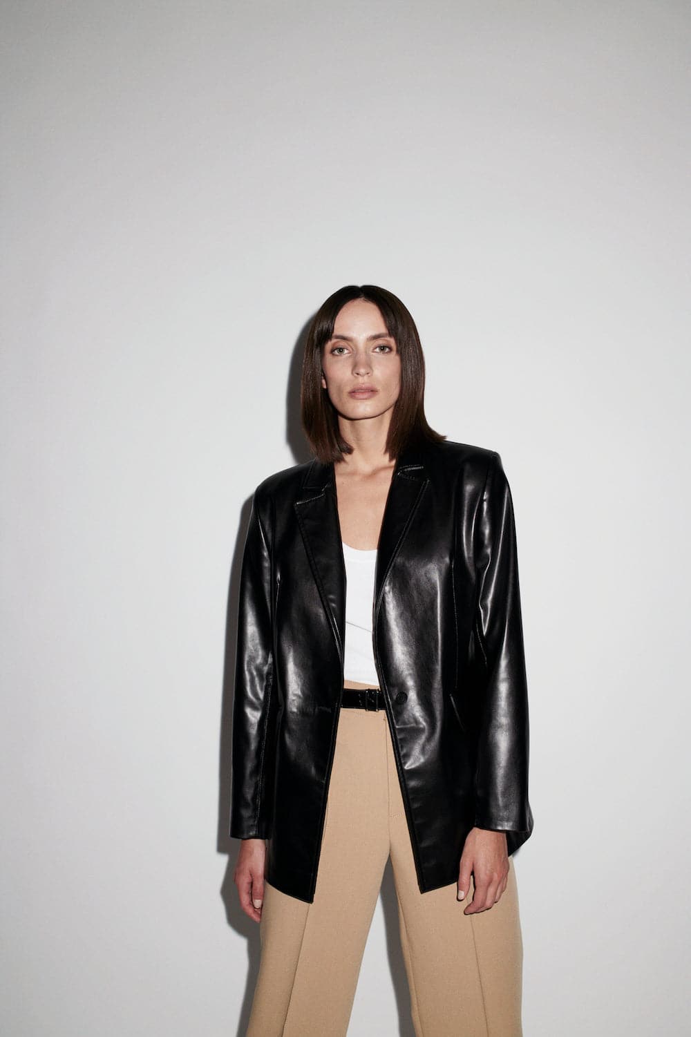 Black Verheyen Chesca oversized leather blazer with wide lapels and relaxed fit, displayed on a hanger.