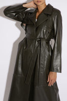 Dark khaki leather trench coat by Verheyen, shown in XXS size, with classic collar and belted waist for a sophisticated look.