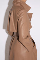 Taupe leather trench coat by Verheyen, featuring a stylish design and classic silhouette, shown in size XXS.